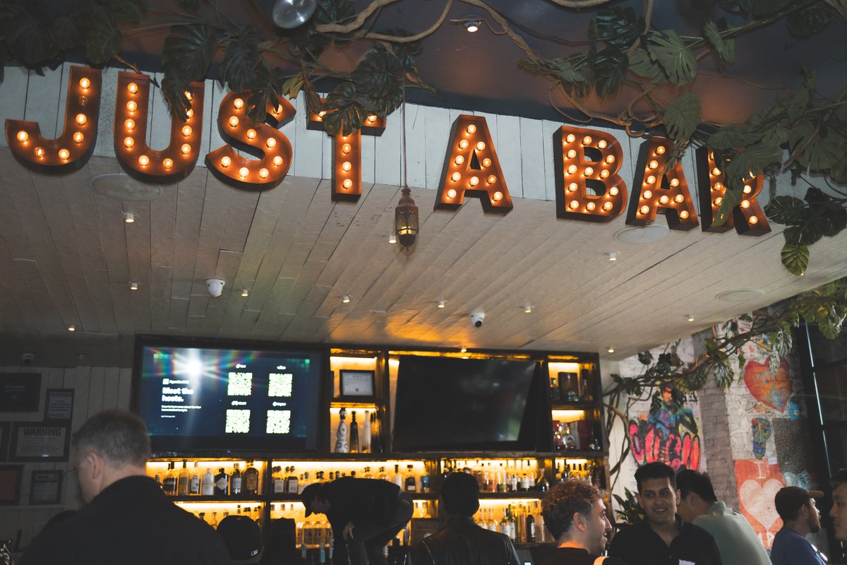 Venue bar sign with attendees