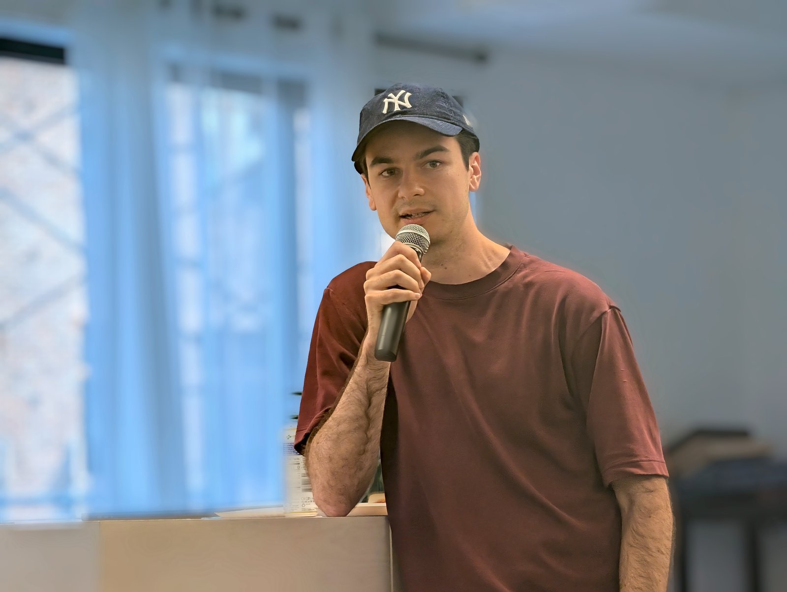 Speaker with microphone mid-answer